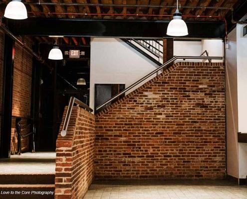 Brick event space interior with beam ceiling renovated by KasCon commercial general contractors