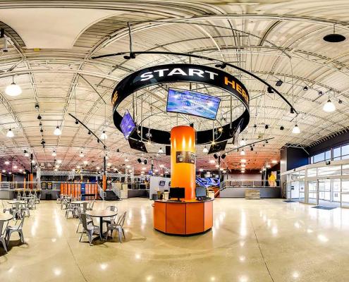 Panoramic view of Sky Zone entry area food vendors and entrances to specialty areas